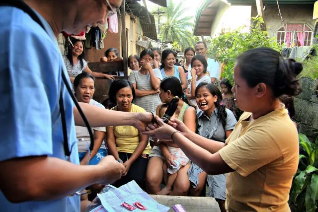 A group of women receiving guidance from a doctor about HIV