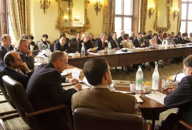 People sat around the conference table at Wilton Park