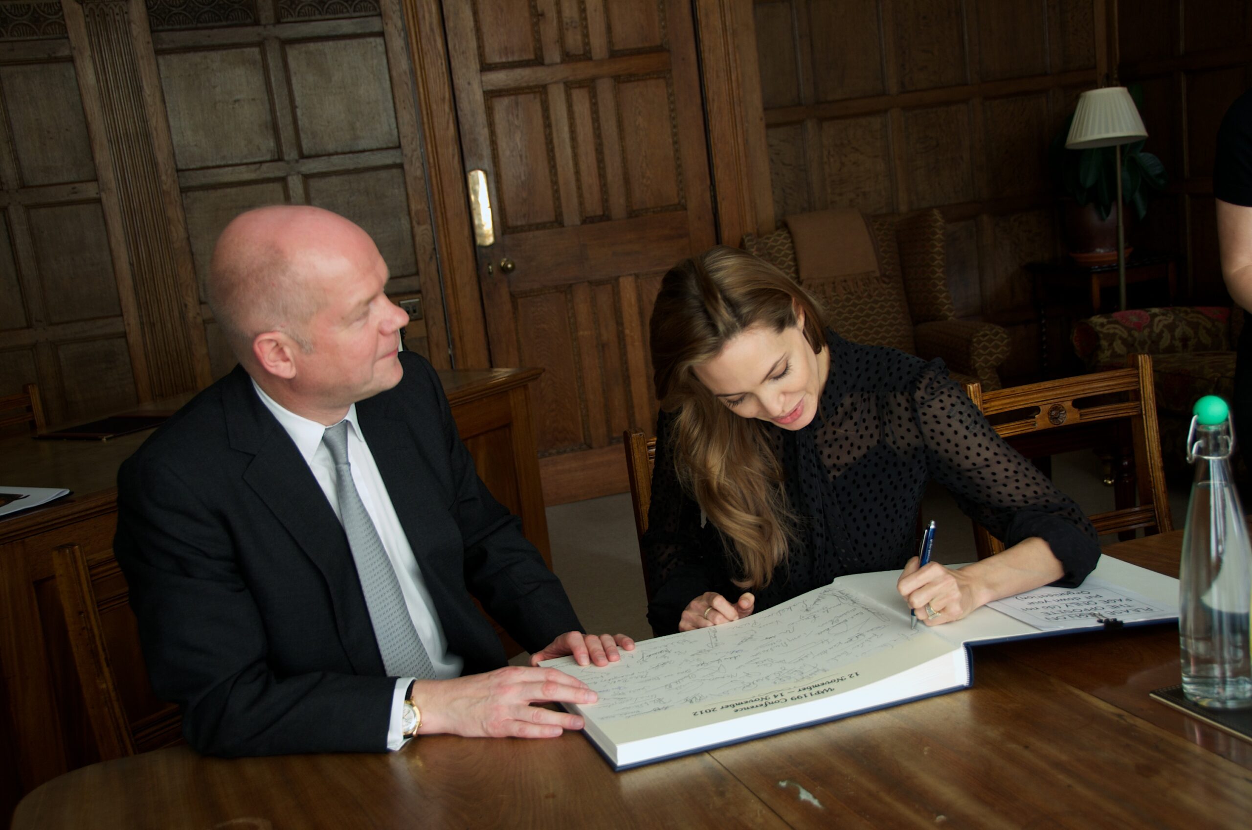 William Hague and Angelina Jolie signing the Golden Book at Wilton Park