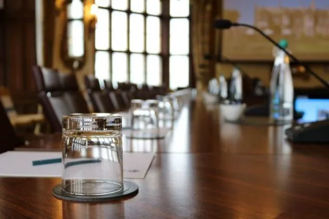 The conference room set up for a Wilton Park event