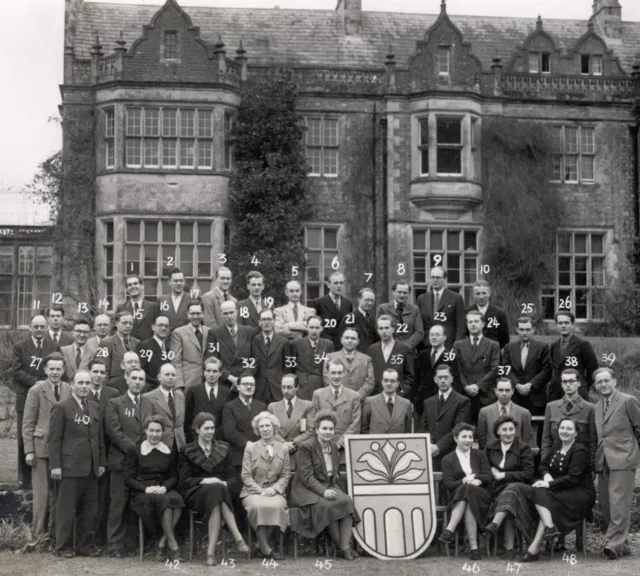 Attendees sit for a group photo at the first session at Wiston House