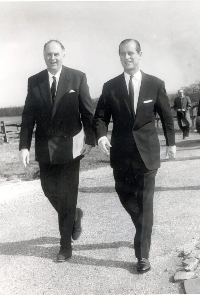 The Duke of Edinburgh walks up a path as he visits Wilton Park.
