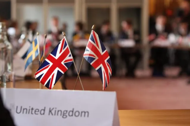 UK flags set up on a conference table