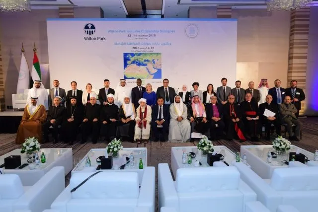 Participants sit for a photograph at an event on inclusive citizenship.