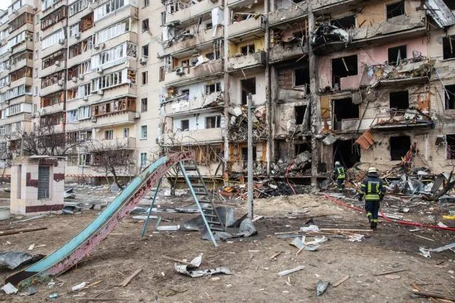 A bomb damaged apartment building in Kyiv, February 2022