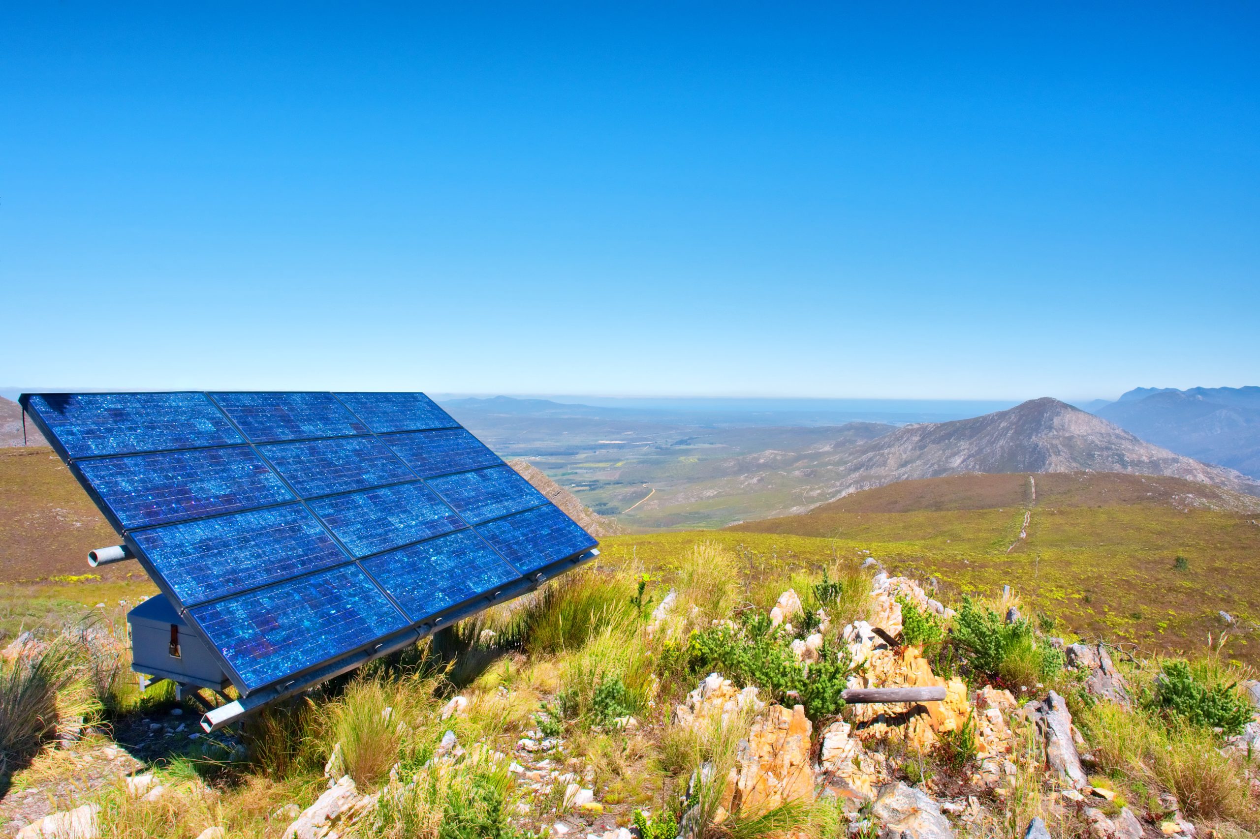Blue,Solar,Cells,Against,Awesome,Mountain,Landscape.,Shot,In,Salmonsdam