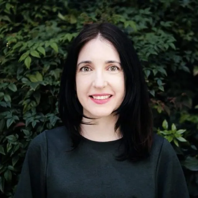 Aisling Conboy poses for a portrait photo and looks directly at the camera.