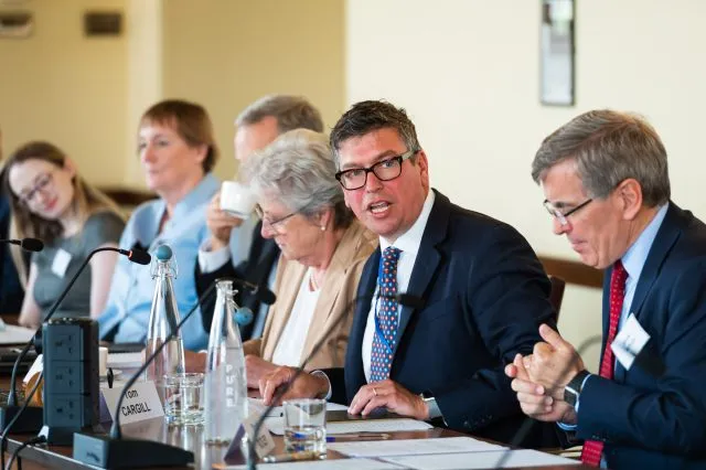 Tom Cargill, Chief Executive of Wilton Park, delivers a speech at the Ambassadorial Summit, July 2023.