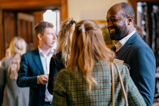 Participants at break time during a conference at Wilton Park