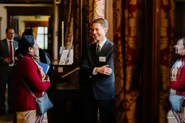 Participants in conversation during break at the Wilton Park event on NPT Diplomacy in December 2023.