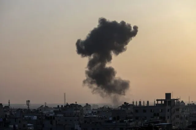 Smoke rises after an Israeli air strike in the city of Rafah, near the Egyptian border in the southern Gaza Strip, on January 01, 2024.