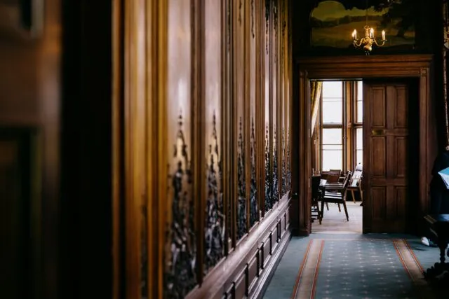 An image of a corridor leading into the conference room with the door open.
