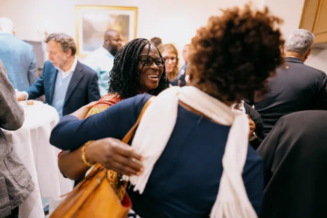 Gertrude Oforiwa Fefoame, Chairperson of the CRPD Committee, greets a fellow participant