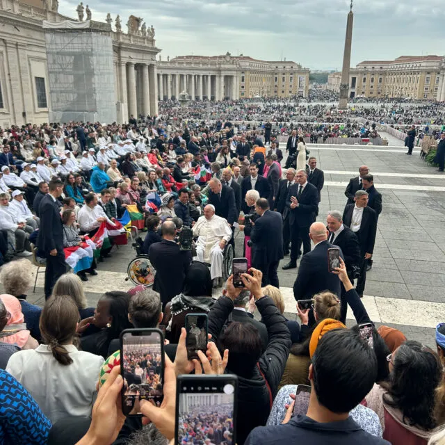 Pope Francis meets with participants.