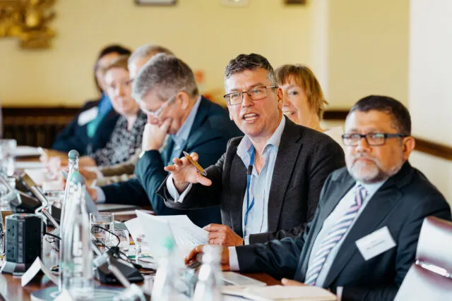 Wilton Park CEO Tom Cargill speaks at the conference table