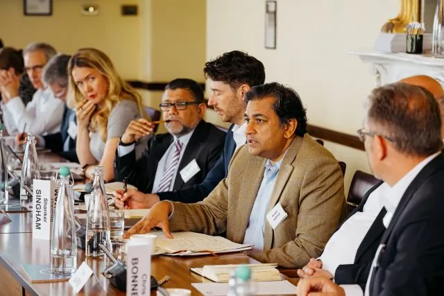 Members of the Global Impact Group in the conference room