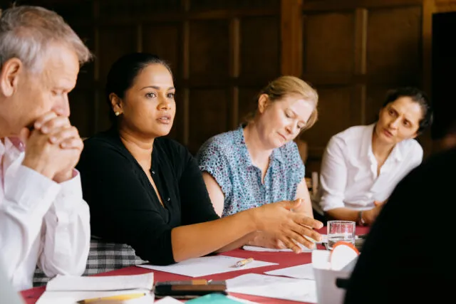 A female participant speaks in a breakout group