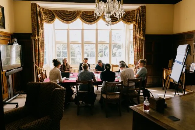 Participants around a table in the Study