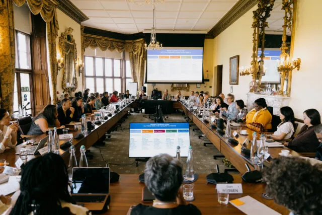 Participants seated round the conference table