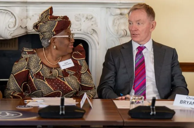 Dr Ngozi Okonjo-Iweala, Director-General of the World Trade Organisation, sits with Sir Chris Bryant MP, Minister of State at the Department for Business and Trade, at the conference table. (2)