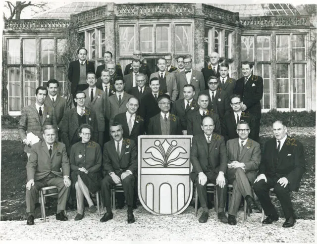 Delegates pose for a group photo in the snow