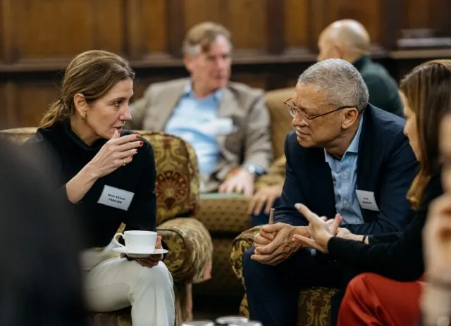 Two participants talk in the common room