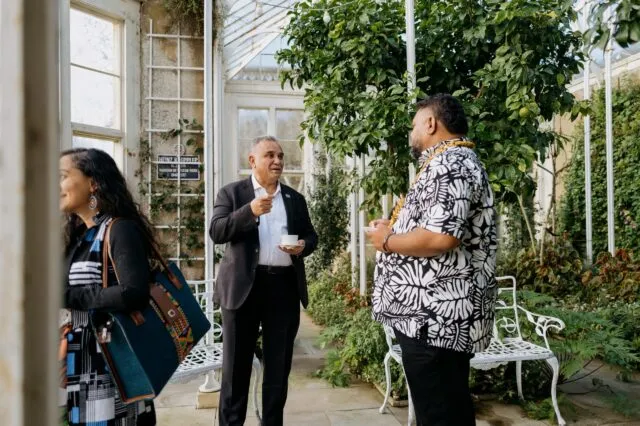 Participants talk in the Orangery