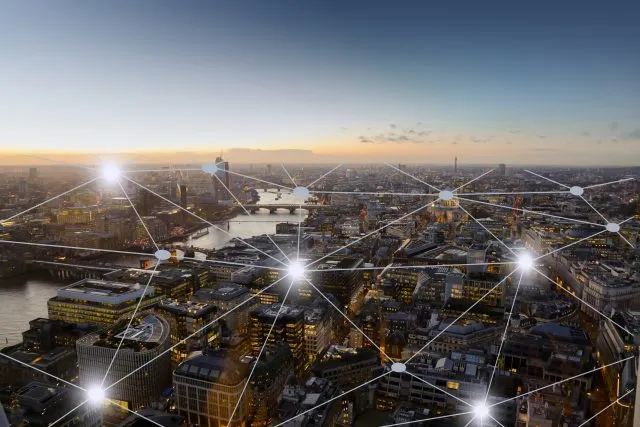 A cityscape connected by grid lines and dots