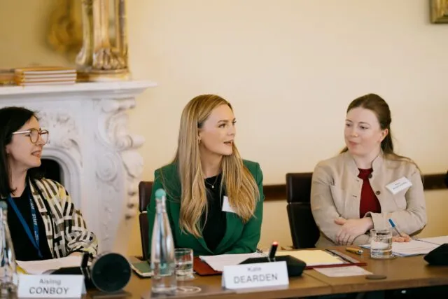 Kate Dearden MP speaks at the conference table