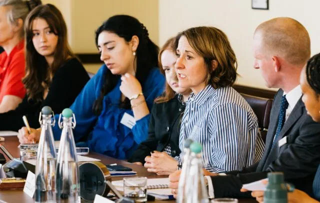 Liz Kendall MP speaks at the Wilton Park conference table