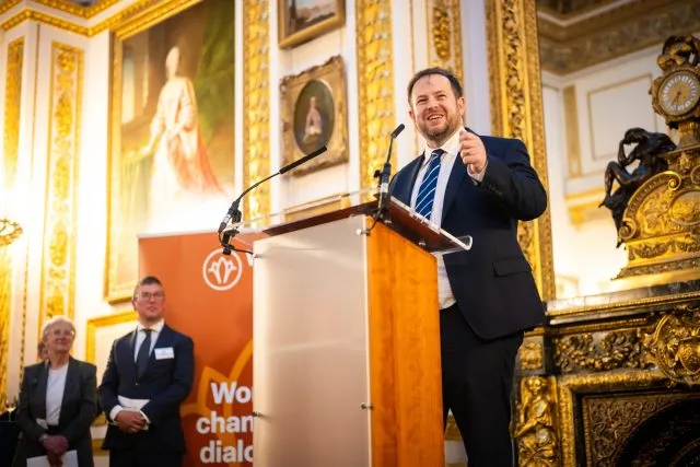 Stephen Doughty MP speaks at the lectern in Lancaster House