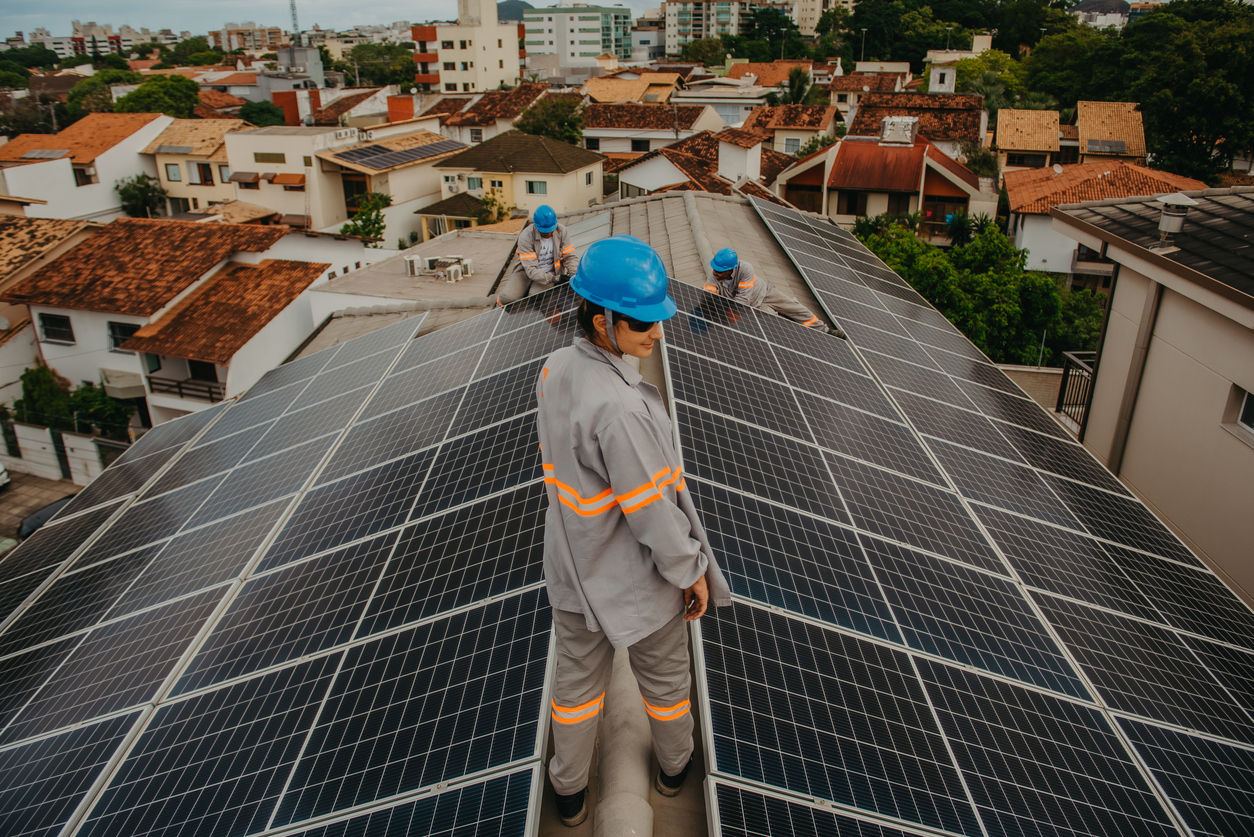 woman working on installation and maintenance of solar panels