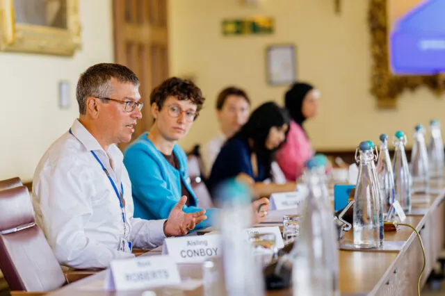 Wilton Park CEO Tom Cargill speaks at the Wilton Park conference table