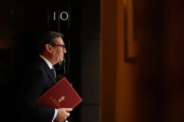 UK prime minister Andy Burnham leaves 10 Downing Street holding a red folder