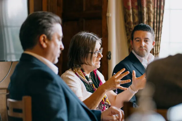 A participant speaking in a breakout group at a Wilton Park dialogue