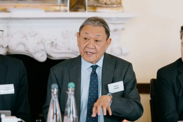 Minister Leong, Parliamentary Under-Secretary of State (Minister for Small Business and Enterprise) in the Department for Business, Innovation, Science and Trade, speaks at the Wilton Park conference table.